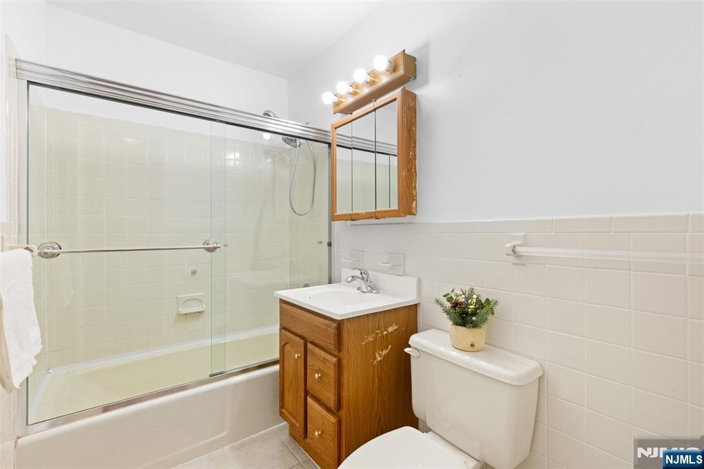 6 Colonial Drive, Unit 6A Little Falls, NJ 07424 - Photo 17 of 44 a bathroom with a sink toilet and shower