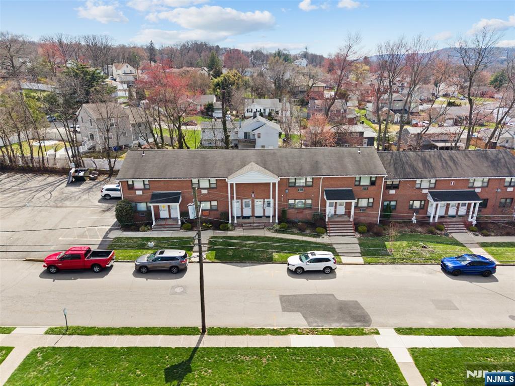 6 Colonial Drive, Unit 6A Little Falls, NJ 07424 - Photo 32 of 44 an aerial view of residential houses with outdoor space