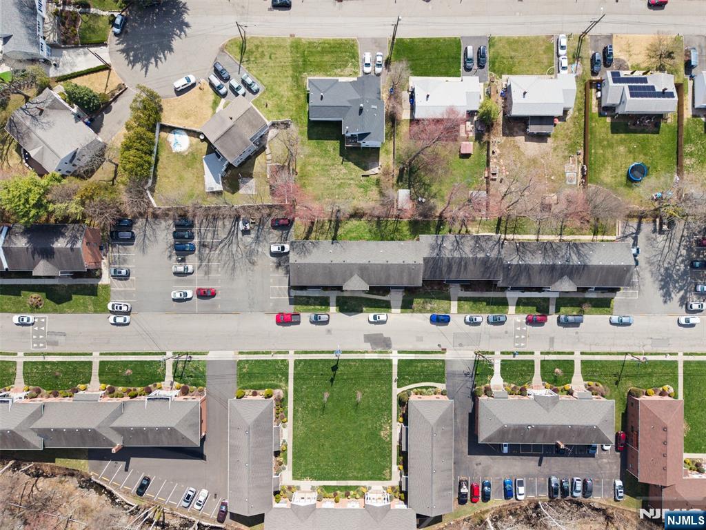 6 Colonial Drive, Unit 6A Little Falls, NJ 07424 - Photo 39 of 44 an aerial view of a building with outdoor space