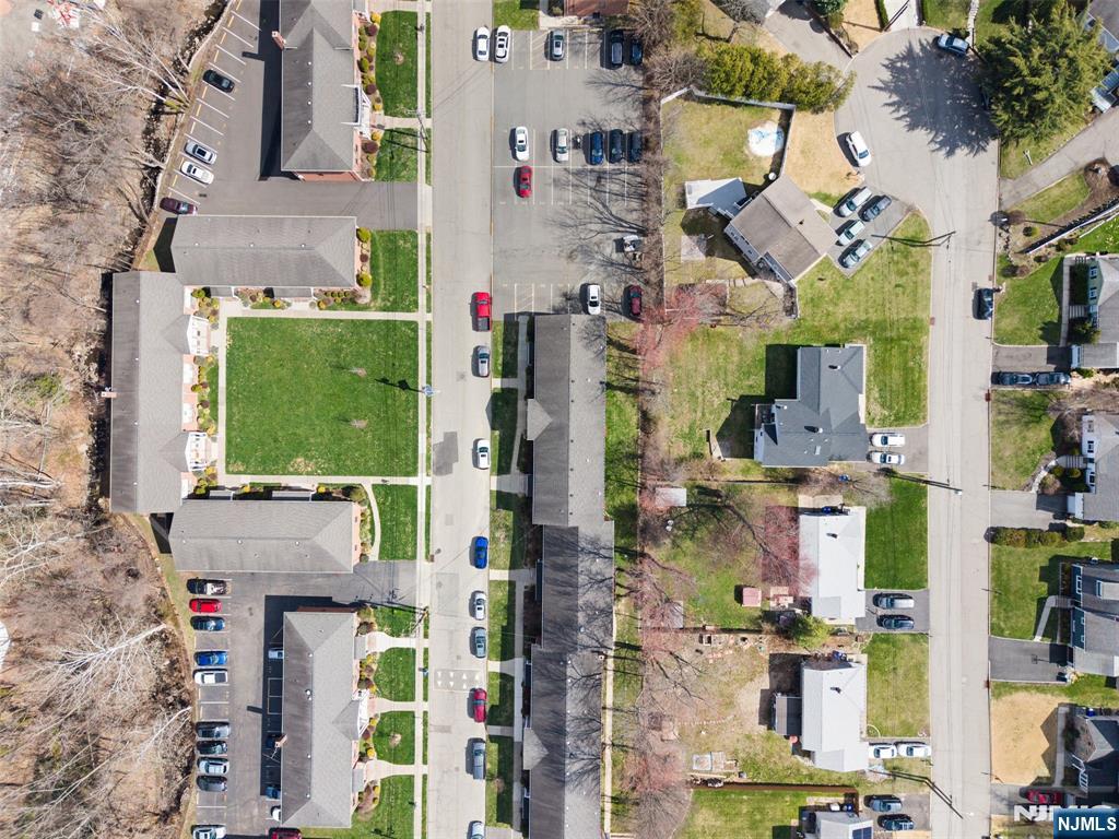 6 Colonial Drive, Unit 6A Little Falls, NJ 07424 - Photo 40 of 44 an aerial view of residential houses with outdoor space and parking