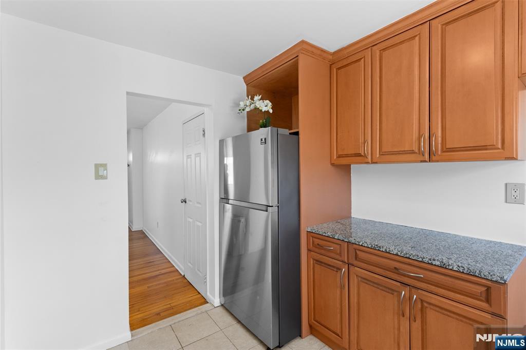 6 Colonial Drive, Unit 6A Little Falls, NJ 07424 - Photo 10 of 44 a kitchen with stainless steel appliances granite countertop a refrigerator and a sink