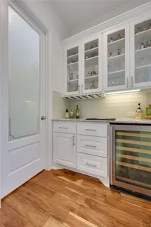 a kitchen with granite countertop cabinets and window