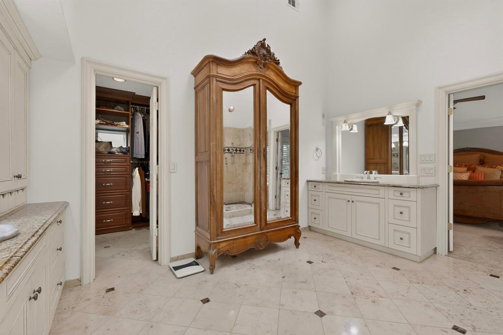 2405 Wing Point Lane Plano, TX 75093 - Photo 23 of 39 a spacious bathroom with a double vanity sink and mirror