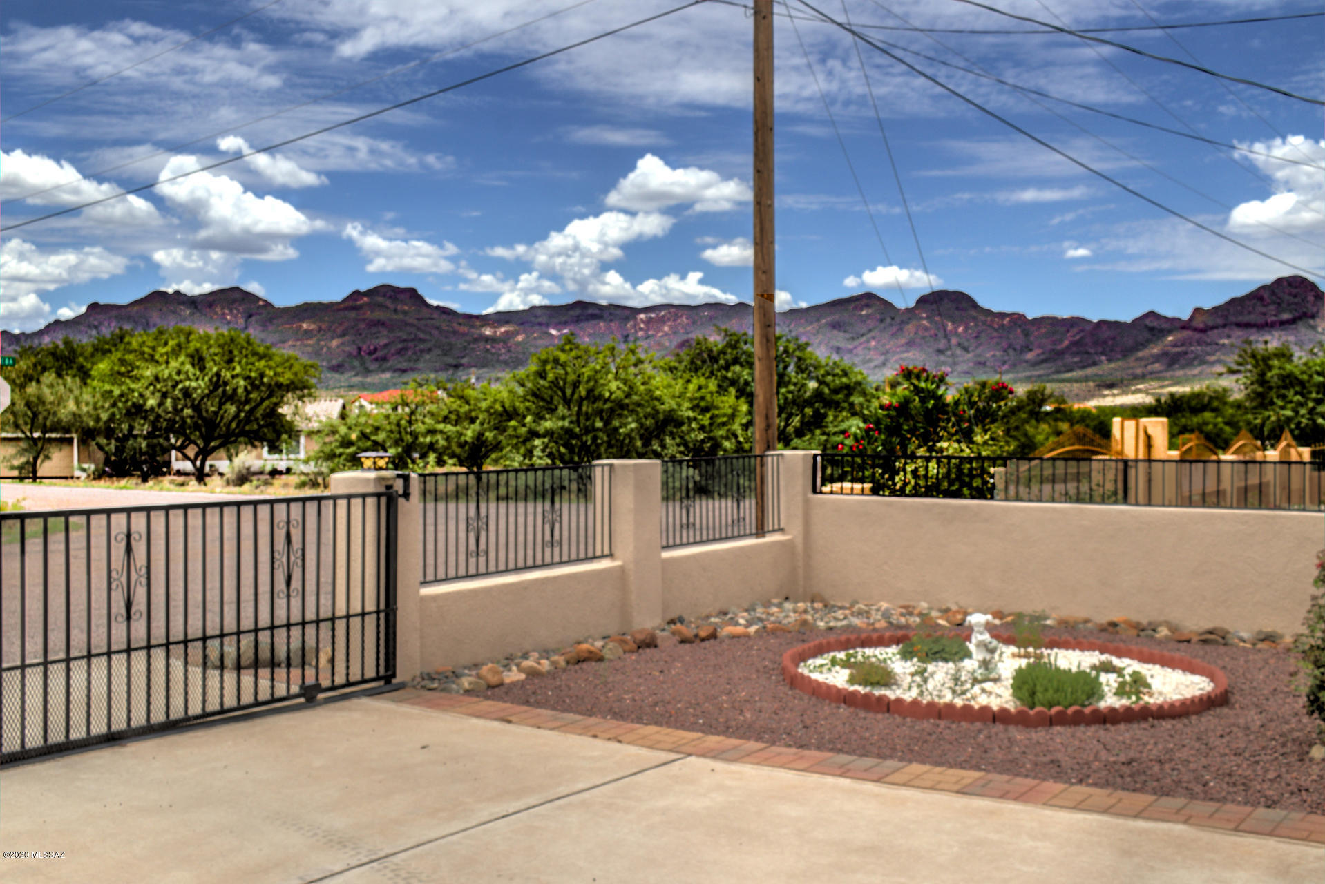 1689 Círculo Alameda Rio Rico, AZ 85648 - Photo 10 of 26 a front view of a house with a yard