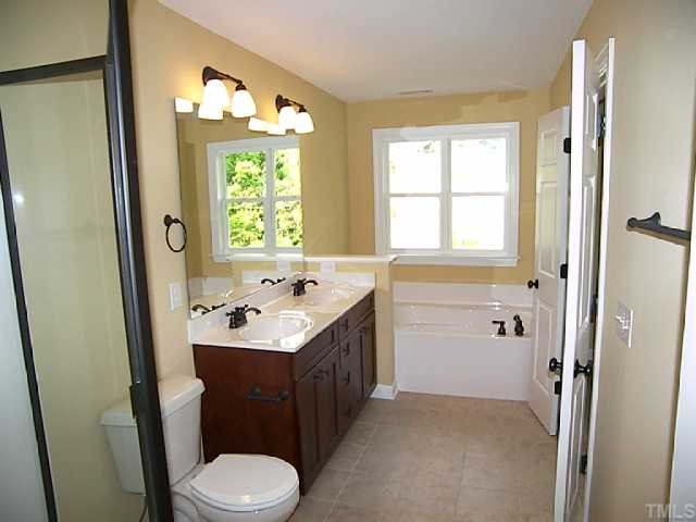 3507 Provost Street Raleigh, NC 27603 - Photo 8 of 12 This is the Austen Plan Model Master bath with upgrades that include: upgrade cabinets, bronze fixtures and tile flooring.