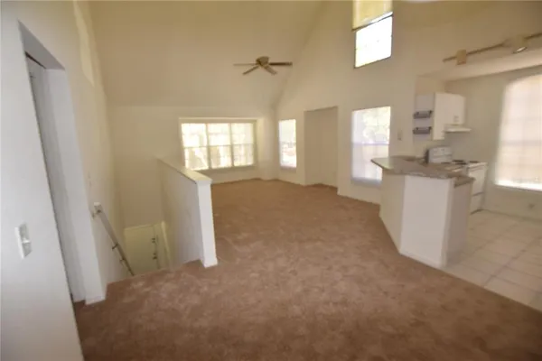 a view of a kitchen with a sink and a window