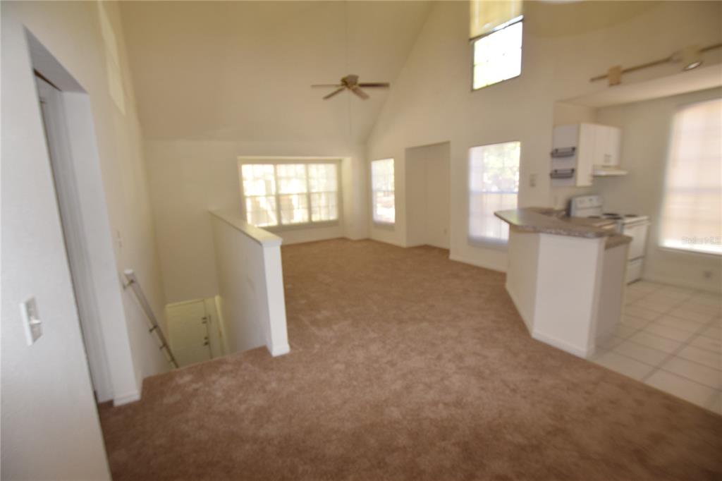 6324 Raleigh Street, Unit 714 Orlando, FL 32835 - Photo 11 of 32 a view of a kitchen with a sink and a window