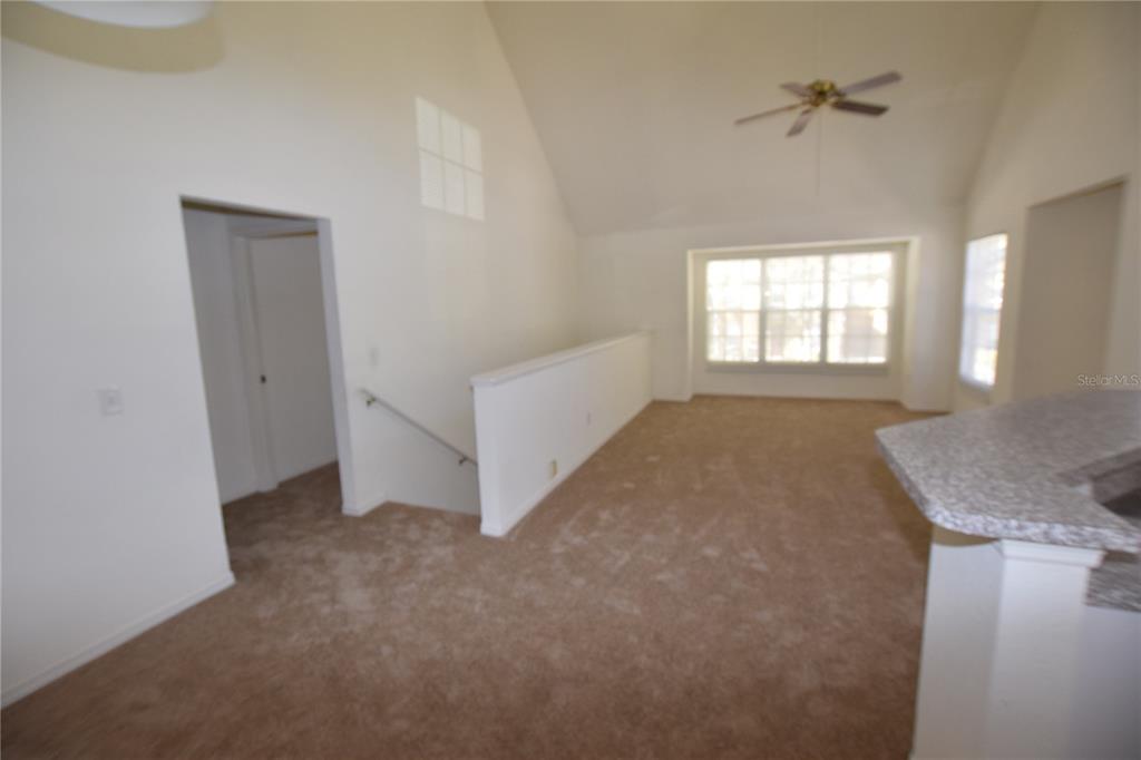 6324 Raleigh Street, Unit 714 Orlando, FL 32835 - Photo 12 of 32 an empty room with windows