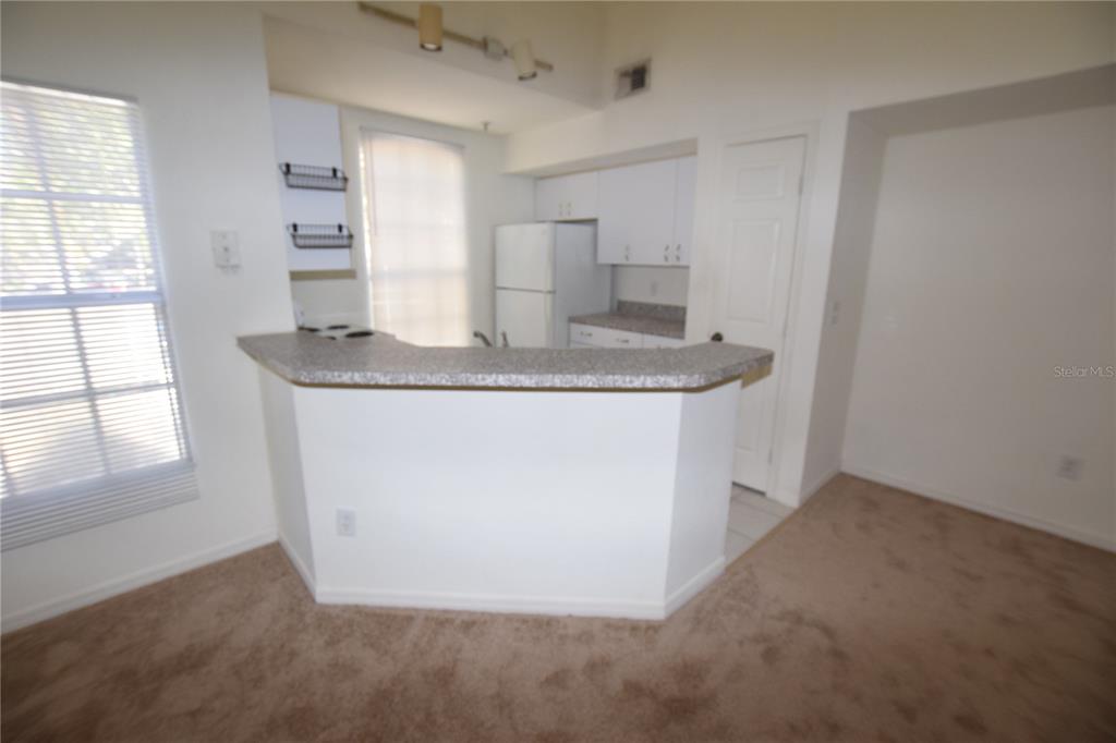 6324 Raleigh Street, Unit 714 Orlando, FL 32835 - Photo 14 of 32 an empty room with windows