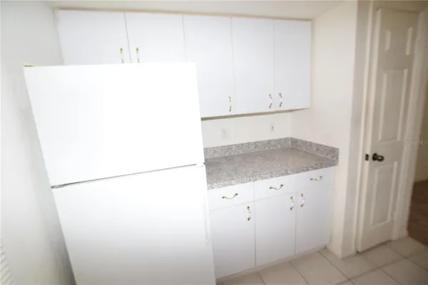 a utility room with cabinets