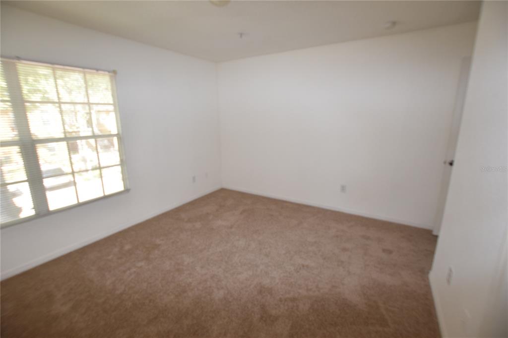6324 Raleigh Street, Unit 714 Orlando, FL 32835 - Photo 22 of 32 an empty room with a window