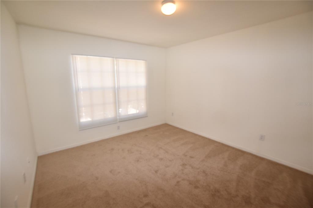 6324 Raleigh Street, Unit 714 Orlando, FL 32835 - Photo 25 of 32 an empty room with a window