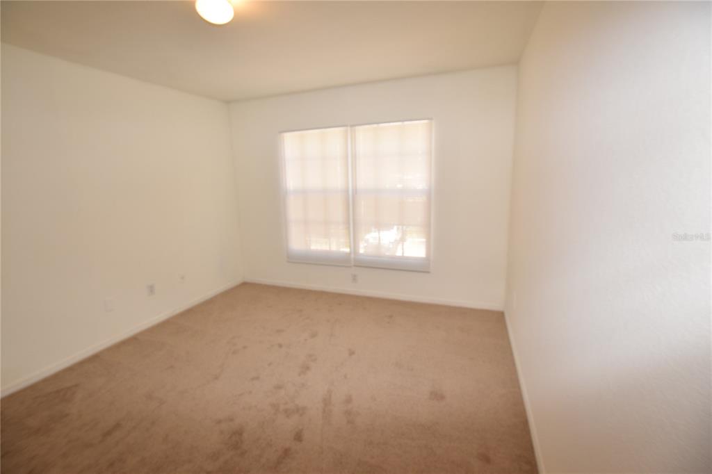 6324 Raleigh Street, Unit 714 Orlando, FL 32835 - Photo 26 of 32 an empty room with a window