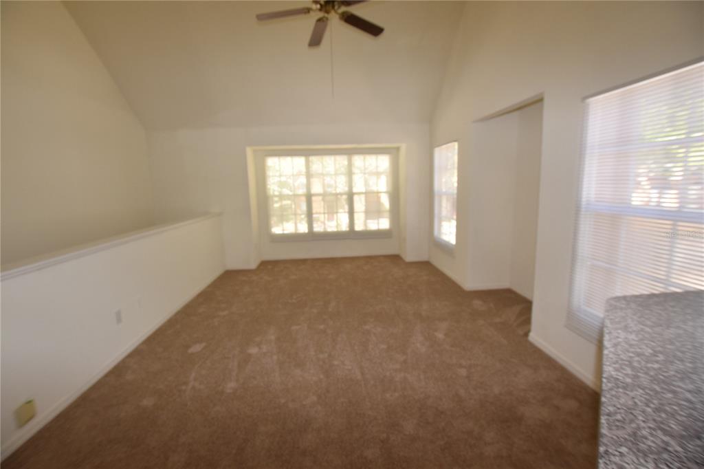 6324 Raleigh Street, Unit 714 Orlando, FL 32835 - Photo 5 of 32 a view of empty room with a window