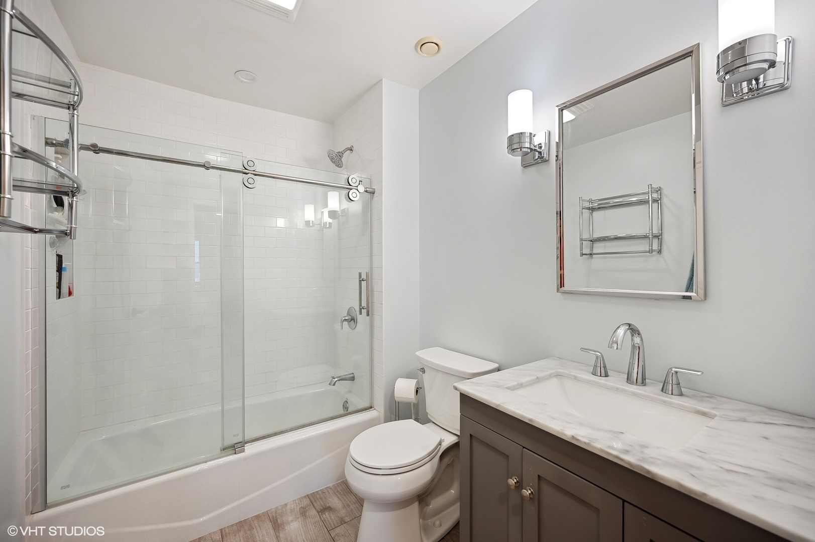 1165 West Deerpath Road Lake Forest, IL 60045 - Photo 13 of 16 a bathroom with a granite countertop sink toilet and shower