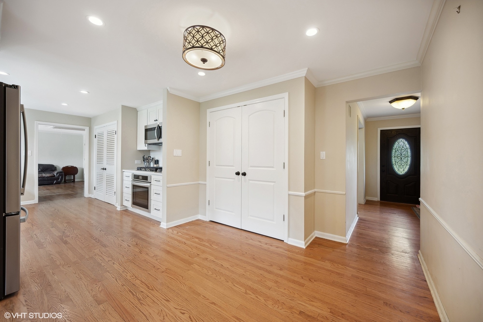 1165 West Deerpath Road Lake Forest, IL 60045 - Photo 4 of 16 a view of a kitchen with a sink and a refrigerator