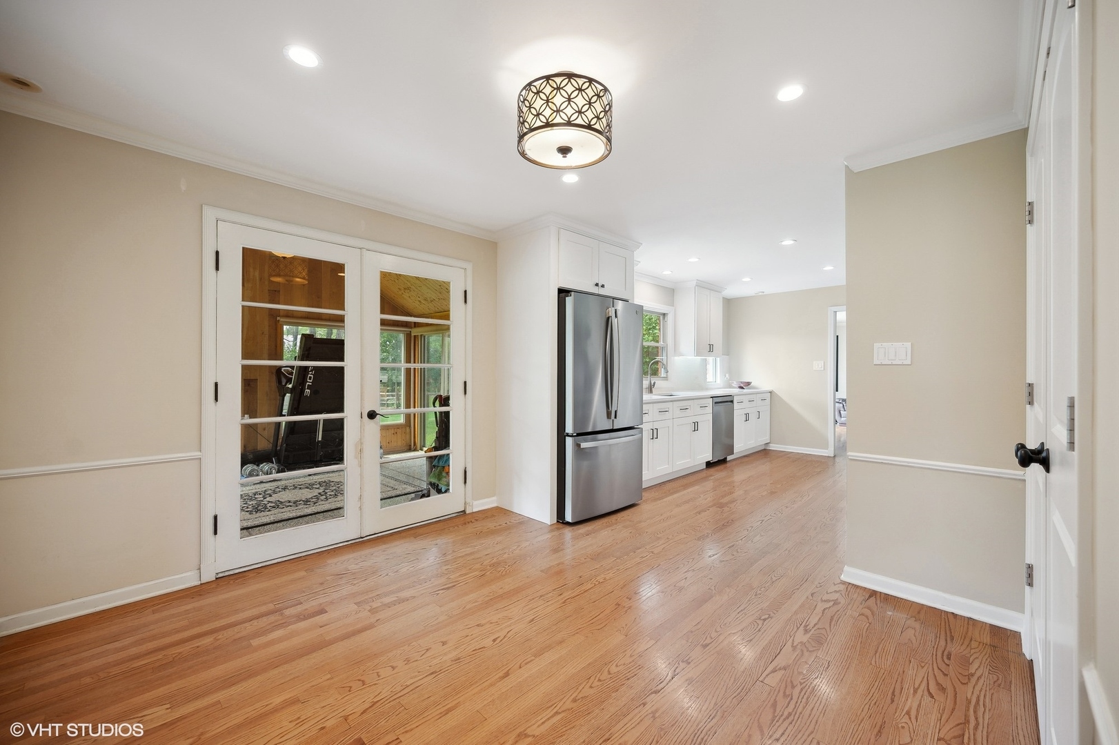 1165 West Deerpath Road Lake Forest, IL 60045 - Photo 5 of 16 a view of a kitchen with refrigerator and wooden floor