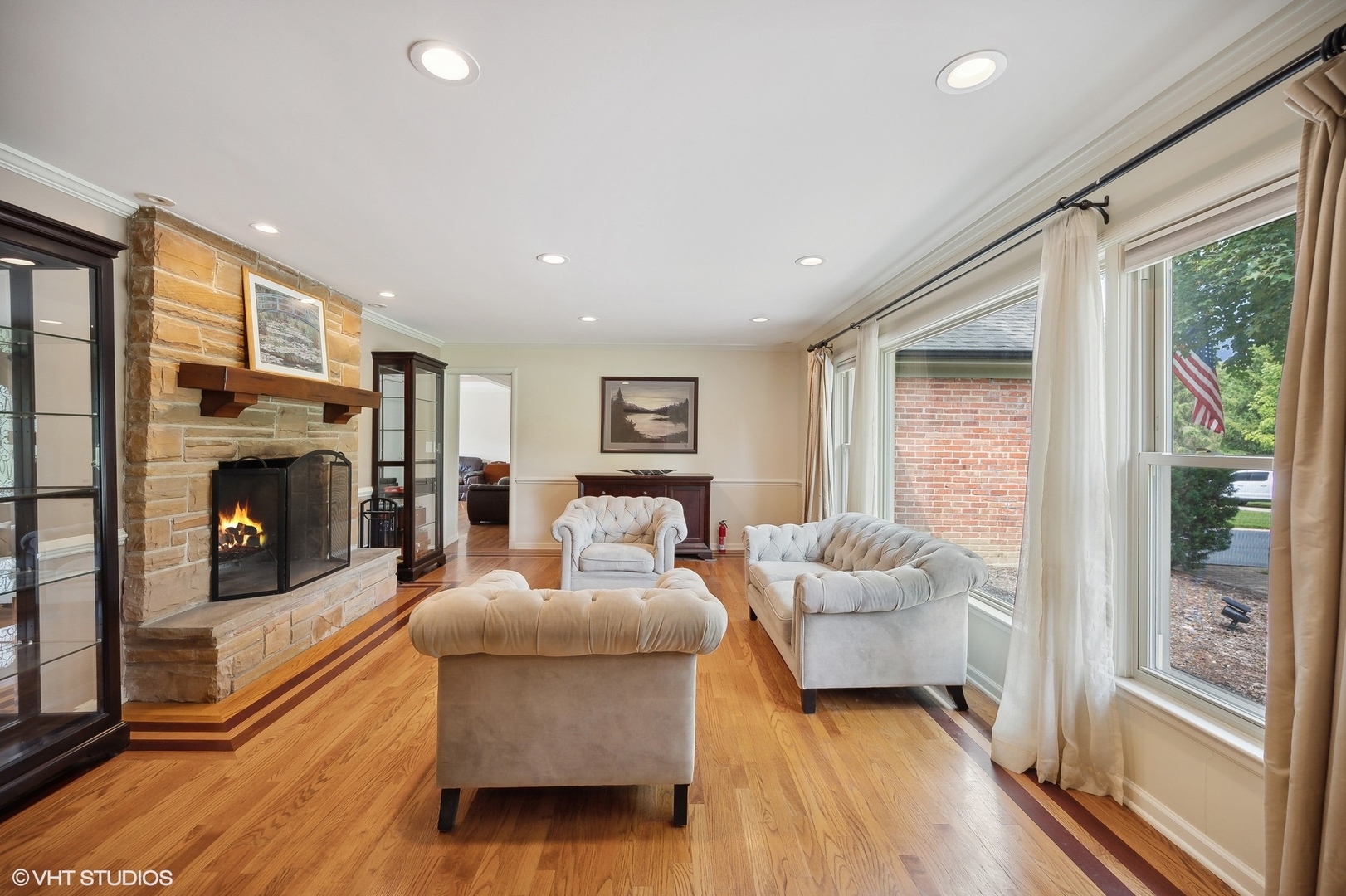 1165 West Deerpath Road Lake Forest, IL 60045 - Photo 8 of 16 a living room with furniture and a fireplace