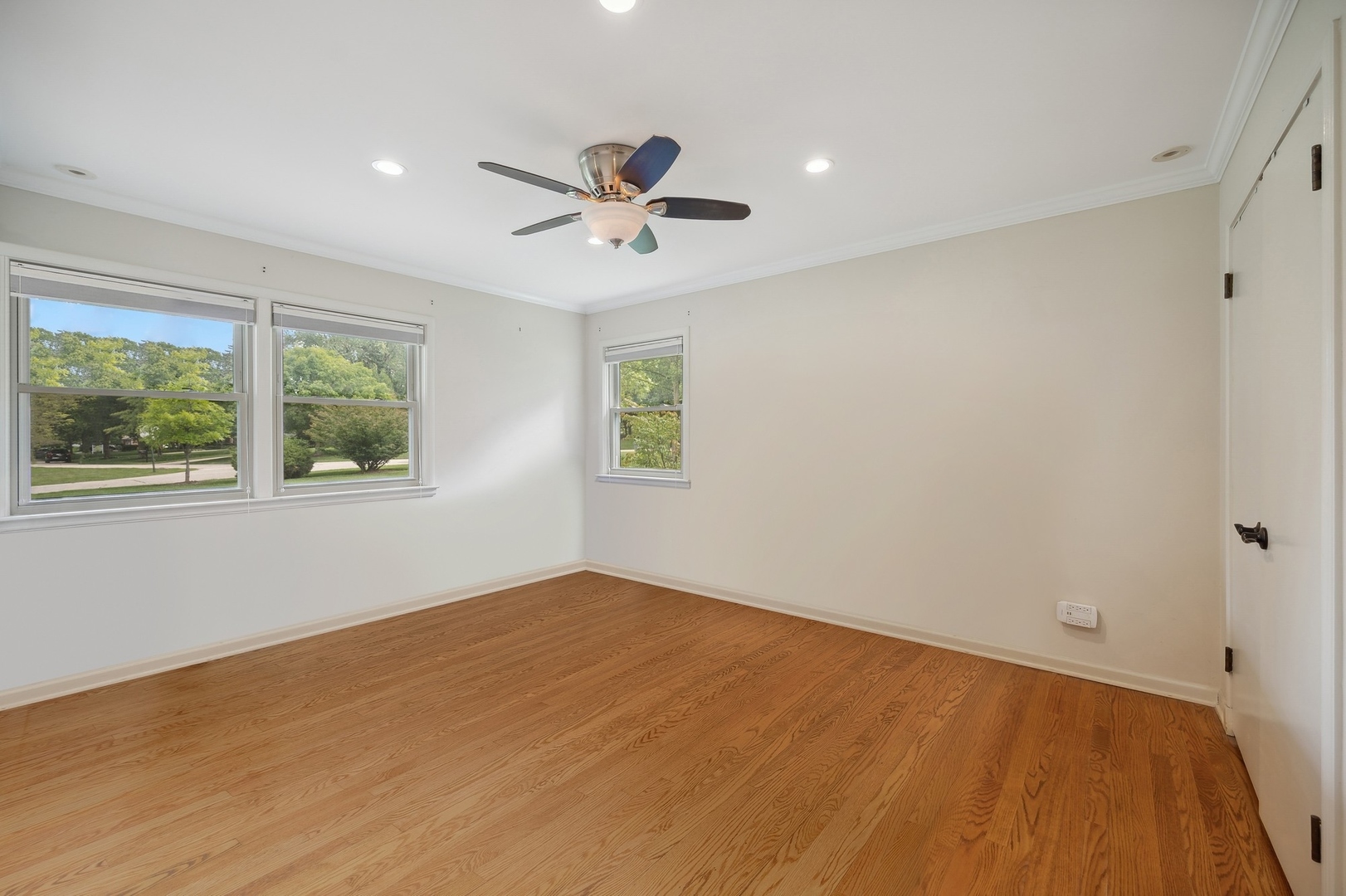 1165 West Deerpath Road Lake Forest, IL 60045 - Photo 9 of 16 a view of an empty room with a window