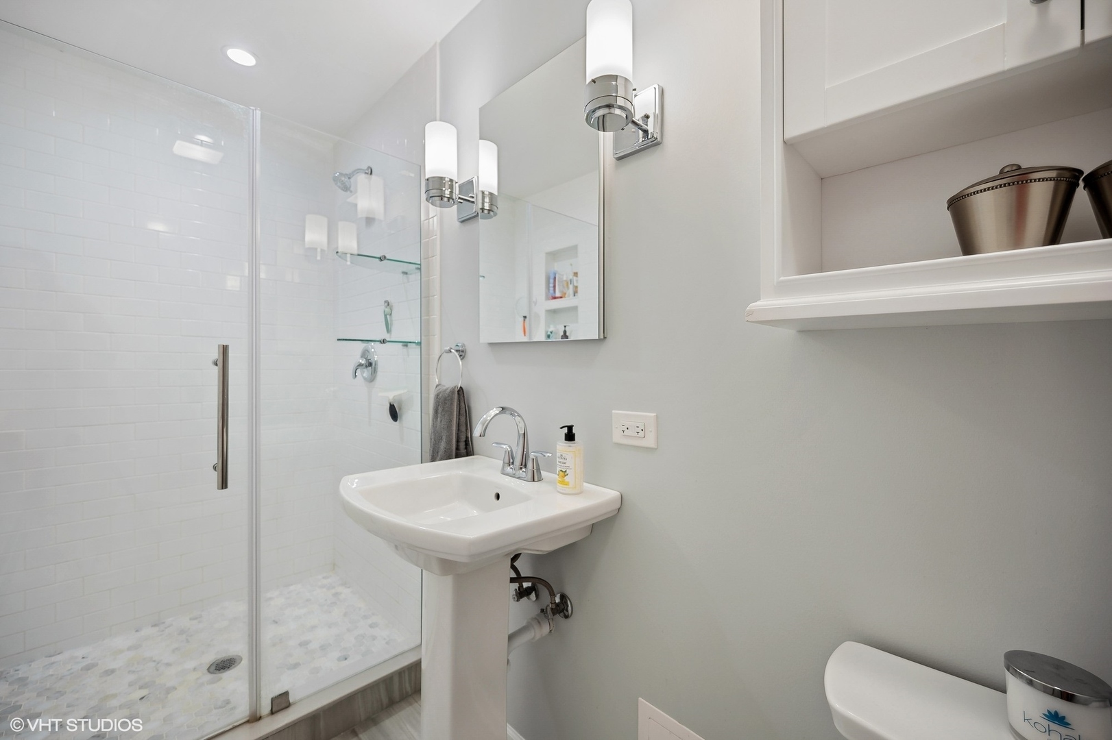 1165 West Deerpath Road Lake Forest, IL 60045 - Photo 10 of 16 a bathroom with a sink a toilet and shower