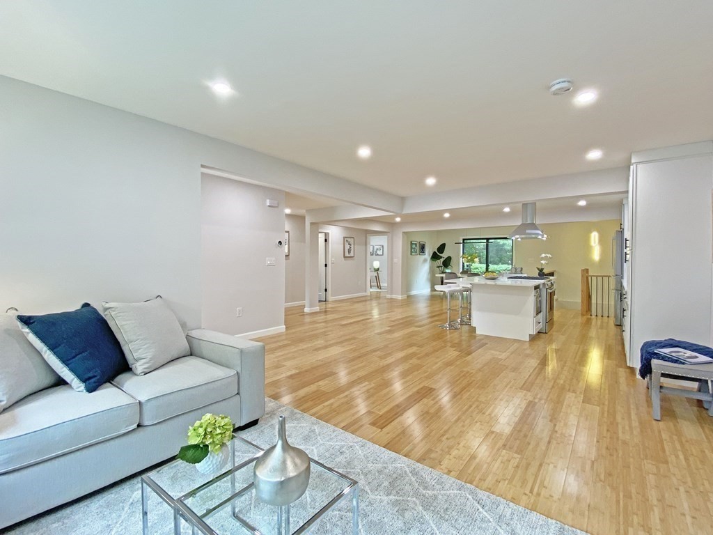 9 Glazer Road, Unit 9 Newton, MA 02459 - Photo 14 of 40 a view of living room filled with furniture and wooden floor