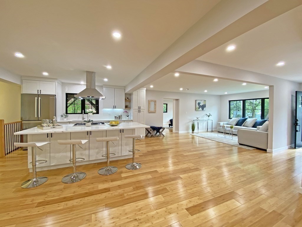 9 Glazer Road, Unit 9 Newton, MA 02459 - Photo 2 of 40 a large room with lots of furniture and a table