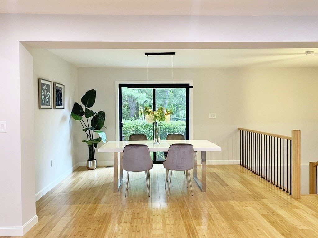 9 Glazer Road, Unit 9 Newton, MA 02459 - Photo 7 of 40 a view of a dining room with furniture window and wooden floor