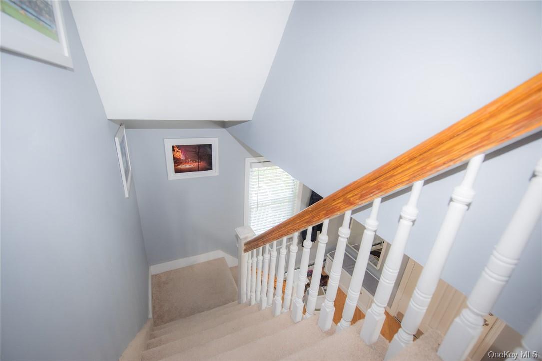 37 South Washington Avenue Hartsdale, NY 10530 - Photo 18 of 34 a view of staircase with wooden floor and white walls