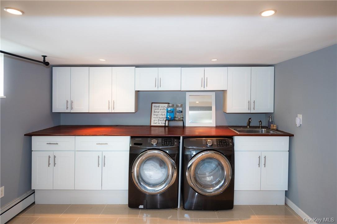 37 South Washington Avenue Hartsdale, NY 10530 - Photo 21 of 34 a utility room with sink dryer and washer