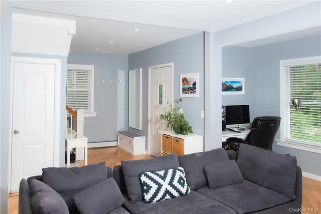 a living room with furniture and a window