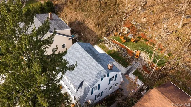 a backyard of a house with yard and outdoor seating