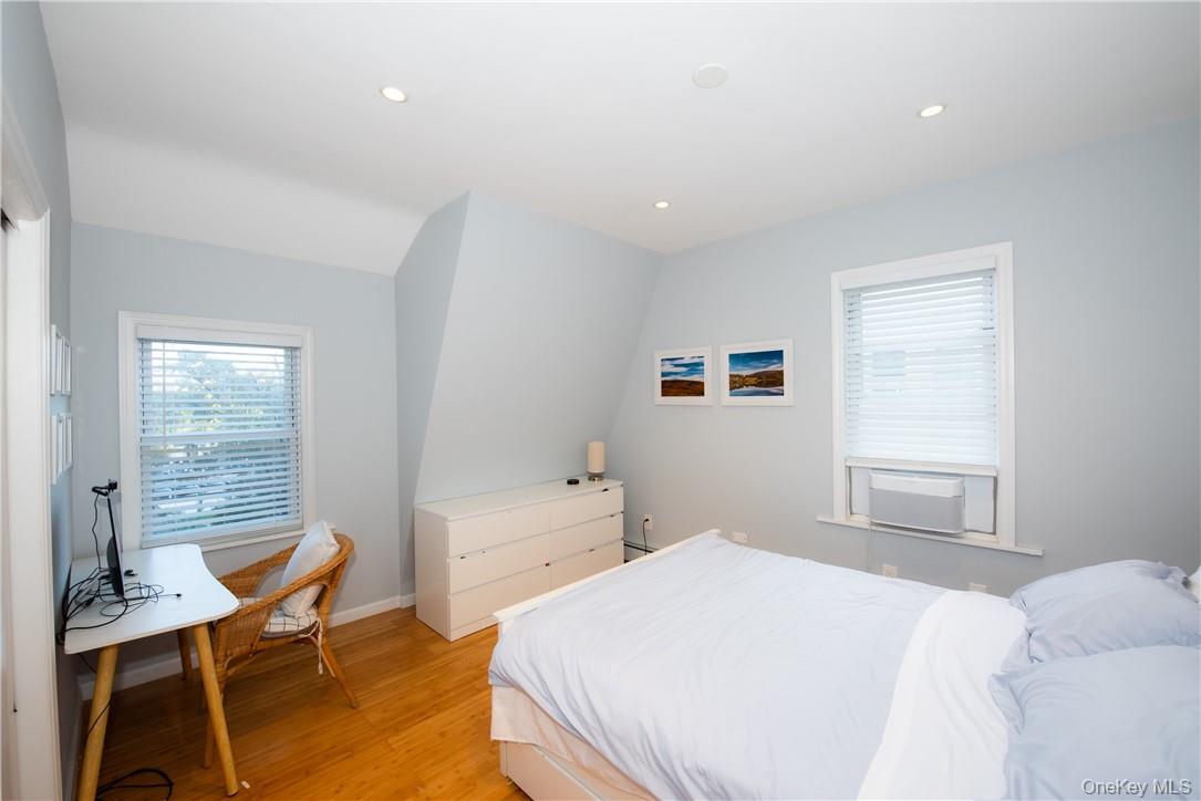 37 South Washington Avenue Hartsdale, NY 10530 - Photo 10 of 34 a bedroom with a bed and a table in it