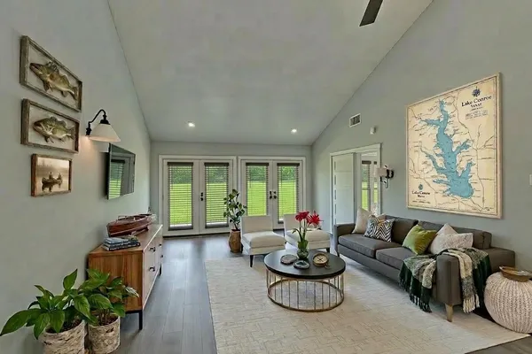a living room with furniture and a large window