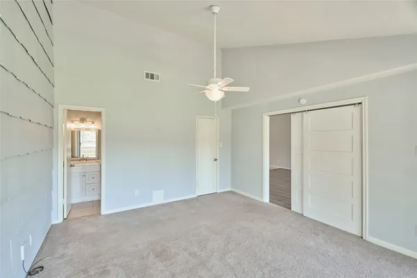 a bedroom with a bed and a table