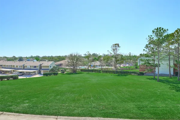 a view of a garden with houses