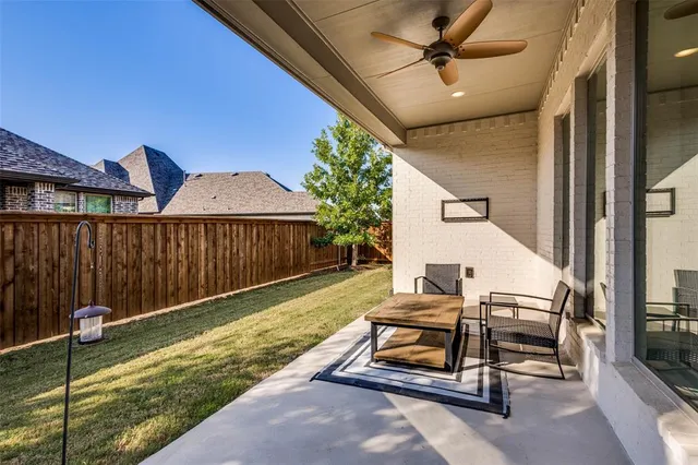 a view of a house with backyard porch and sitting area