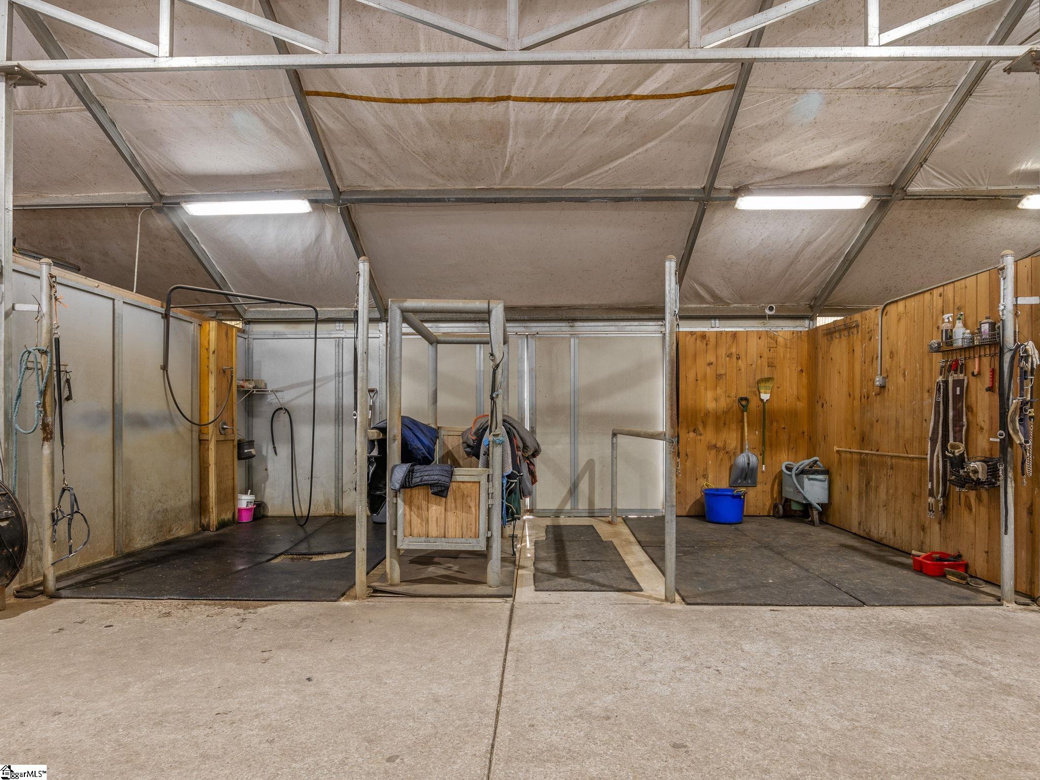 145 Dickson Road Campobello, SC 29322 - Photo 12 of 50 Grooming Stall and Wash Stall. There are 2 grooming and 2 wash stalls in the main barn w/hot/cold water.