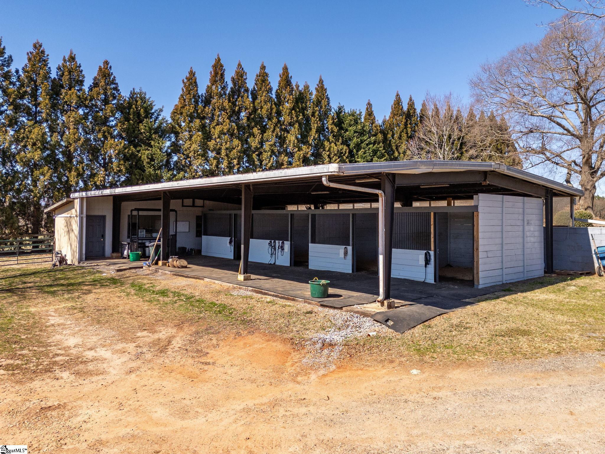 145 Dickson Road Campobello, SC 29322 - Photo 14 of 50 2nd barn is currently set up for Broodmares w/3 extra large stalls. One stall is set up to be divided so you can have 4 stalls total. Barn is close to the house for easy night checks during foaling.