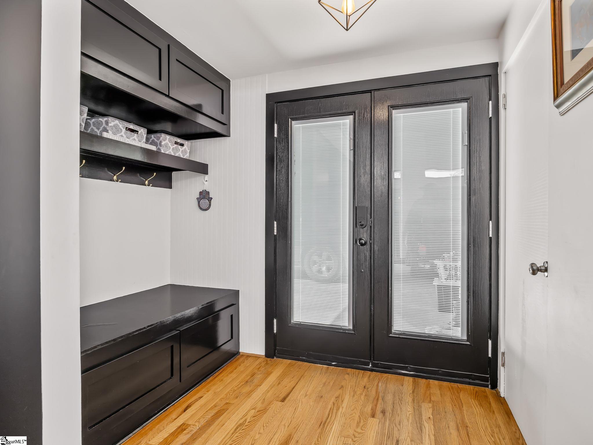 145 Dickson Road Campobello, SC 29322 - Photo 22 of 50 The side entry from the attached carport features a built-in for storage of coats, shoes, backpacks and more