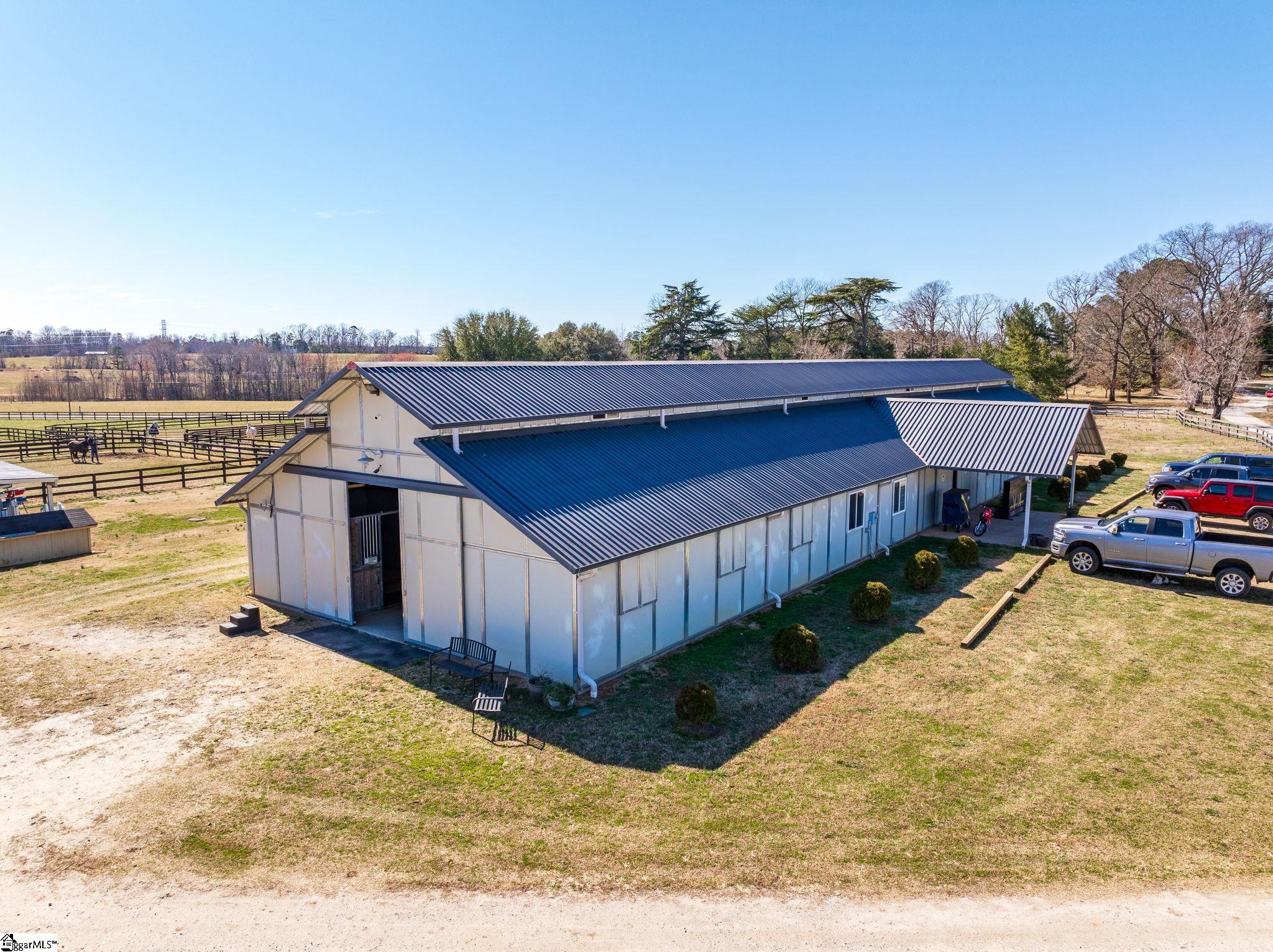 145 Dickson Road Campobello, SC 29322 - Photo 4 of 50 16 stalls, 2 grooming stalls, 2 wash stalls w/hot/cold water, Lounge room, Tack Room, Feed Room, Full Bath w/laundry; Fly suppression system
