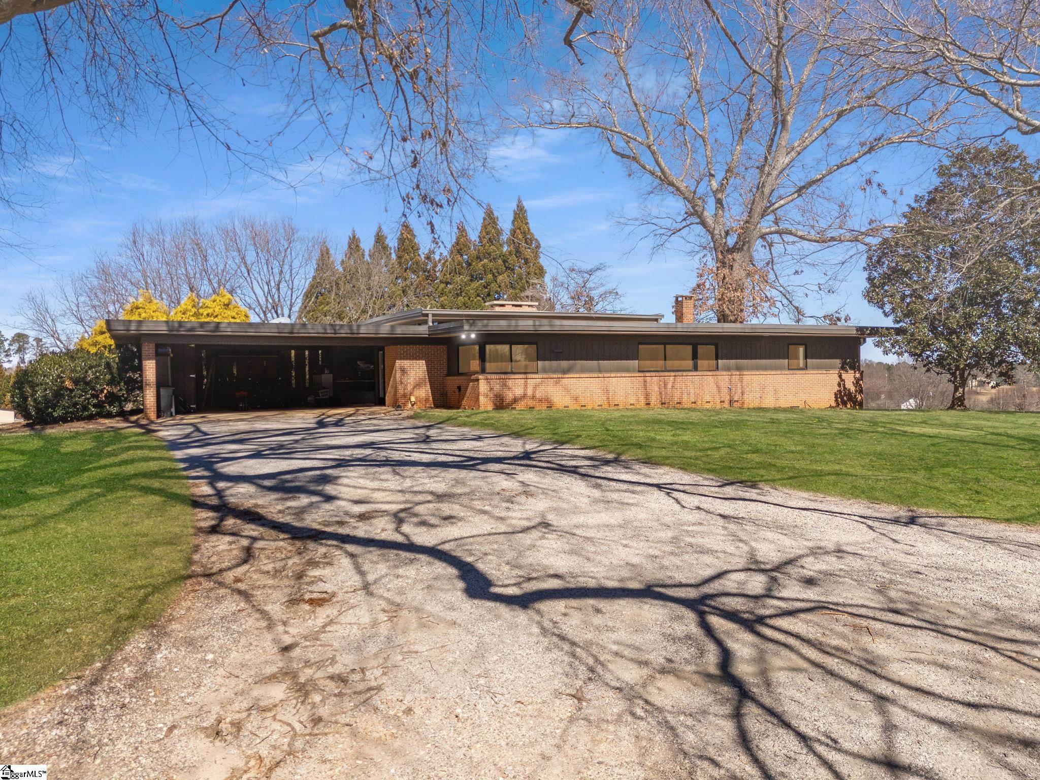 145 Dickson Road Campobello, SC 29322 - Photo 46 of 50 The attached brick carport has room for vehicles and storage