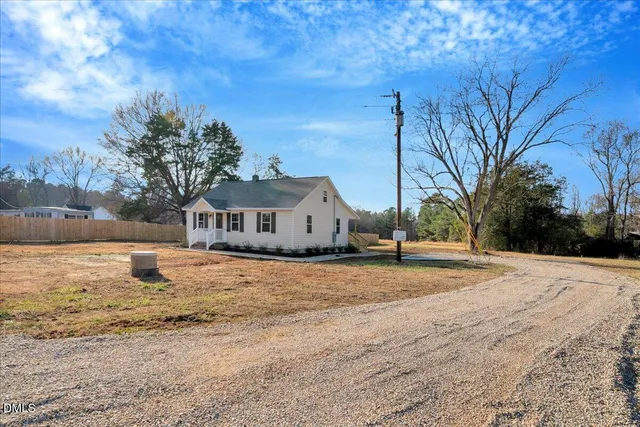 a house with trees in the background