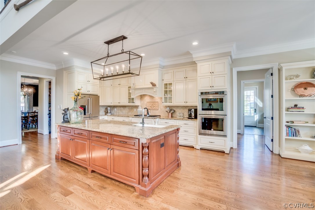 556 Raleigh Manor Road Henrico, VA 23229 - Photo 13 of 41 Large island is highlighted by contrasting wood an