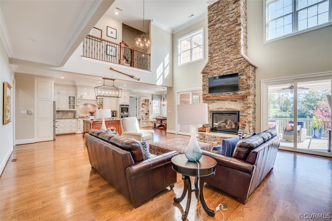 556 Raleigh Manor Road Henrico, VA 23229 - Photo 8 of 41 20' stone fireplace is centered between two glass