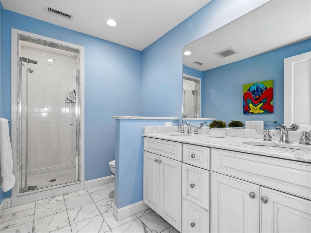 50 Temple Road Wellesley, MA 02482 - Photo 26 of 37 a bathroom with double sink and a shower