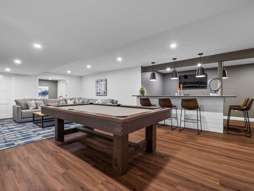 50 Temple Road Wellesley, MA 02482 - Photo 32 of 37 a open kitchen with stainless steel appliances granite countertop a table chairs sink and cabinets