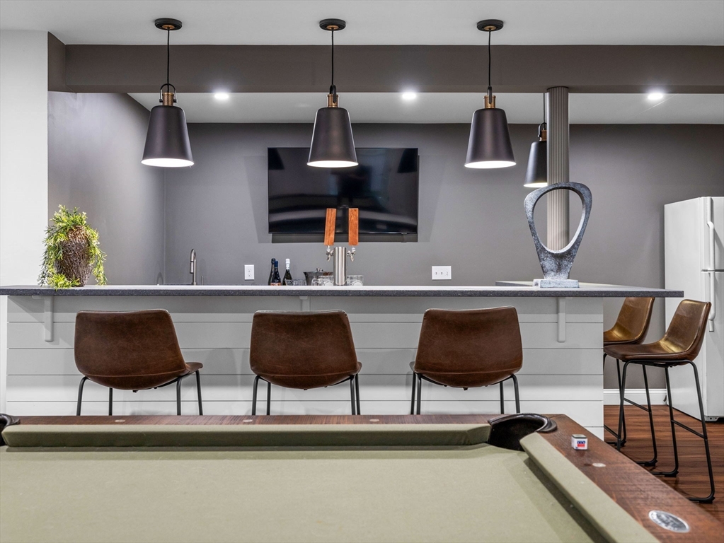 50 Temple Road Wellesley, MA 02482 - Photo 33 of 37 a kitchen with a table chairs and a painting