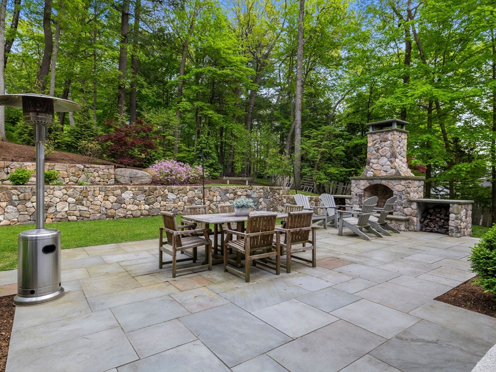 50 Temple Road Wellesley, MA 02482 - Photo 35 of 37 a view of an chairs and table in backyard