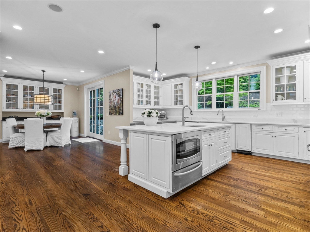 50 Temple Road Wellesley, MA 02482 - Photo 7 of 37 a kitchen with stainless steel appliances granite countertop a stove and a wooden floors