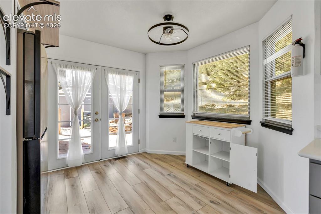 17370 Sweet Road Peyton, CO 80831 - Photo 25 of 38 Lots of natural light in this home, clean and cute. Breakfast nook for your table and french door access to the back yard.